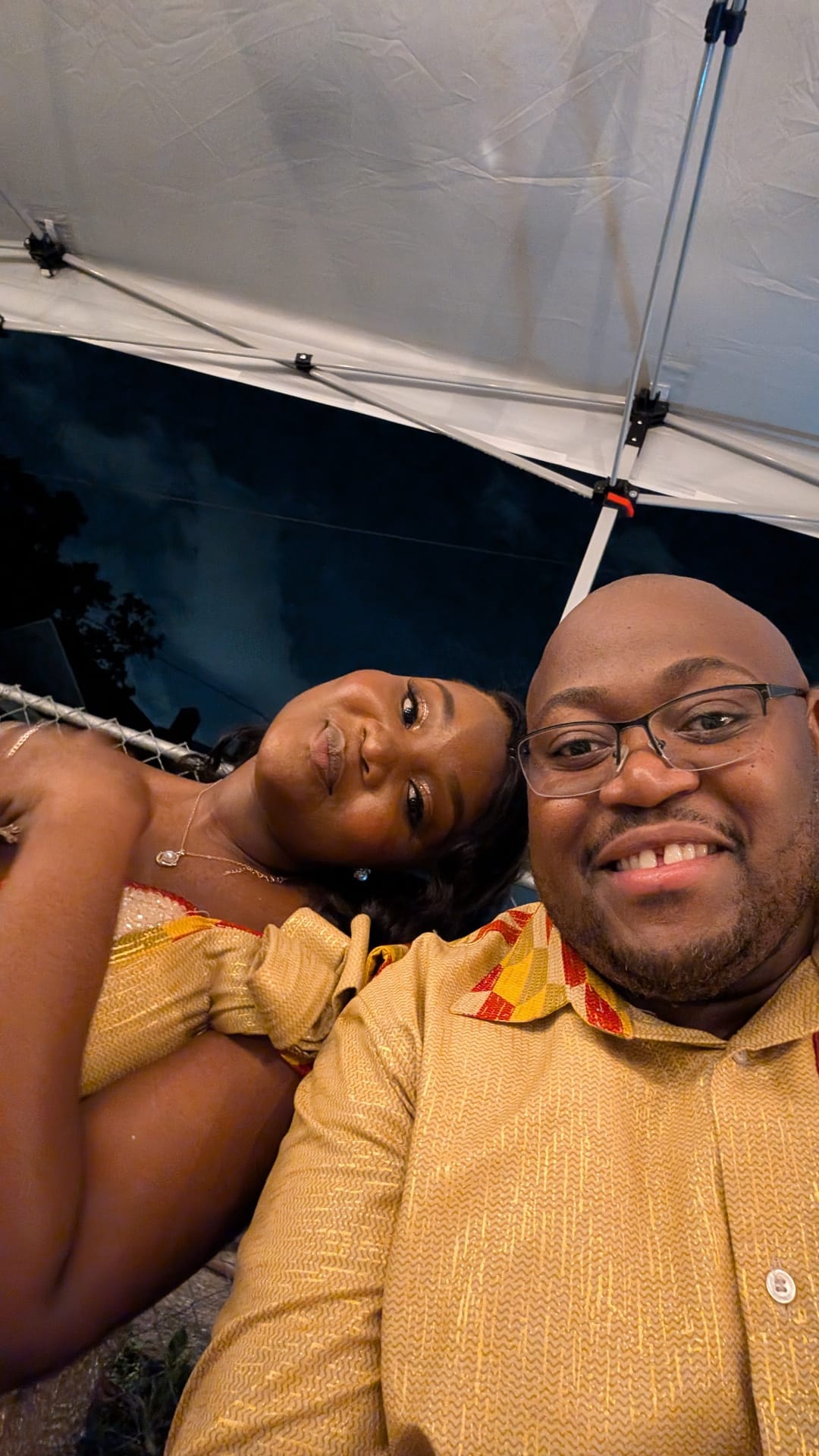 Jean-Philippe and Ketsia under a tent at an event