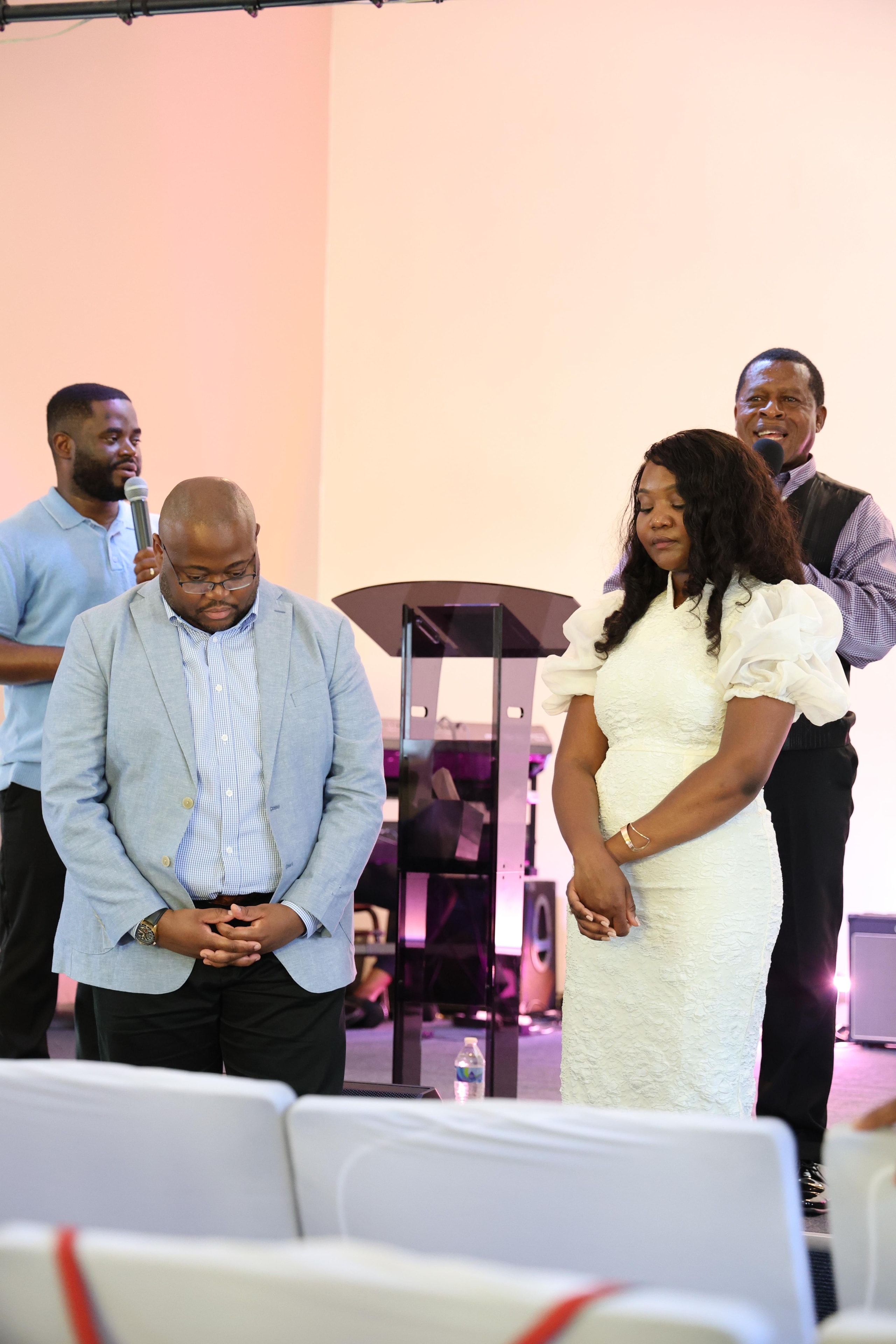 A moment of prayer and worship during the wedding ceremony of Jean-Philippe and Ketsia Matondo
