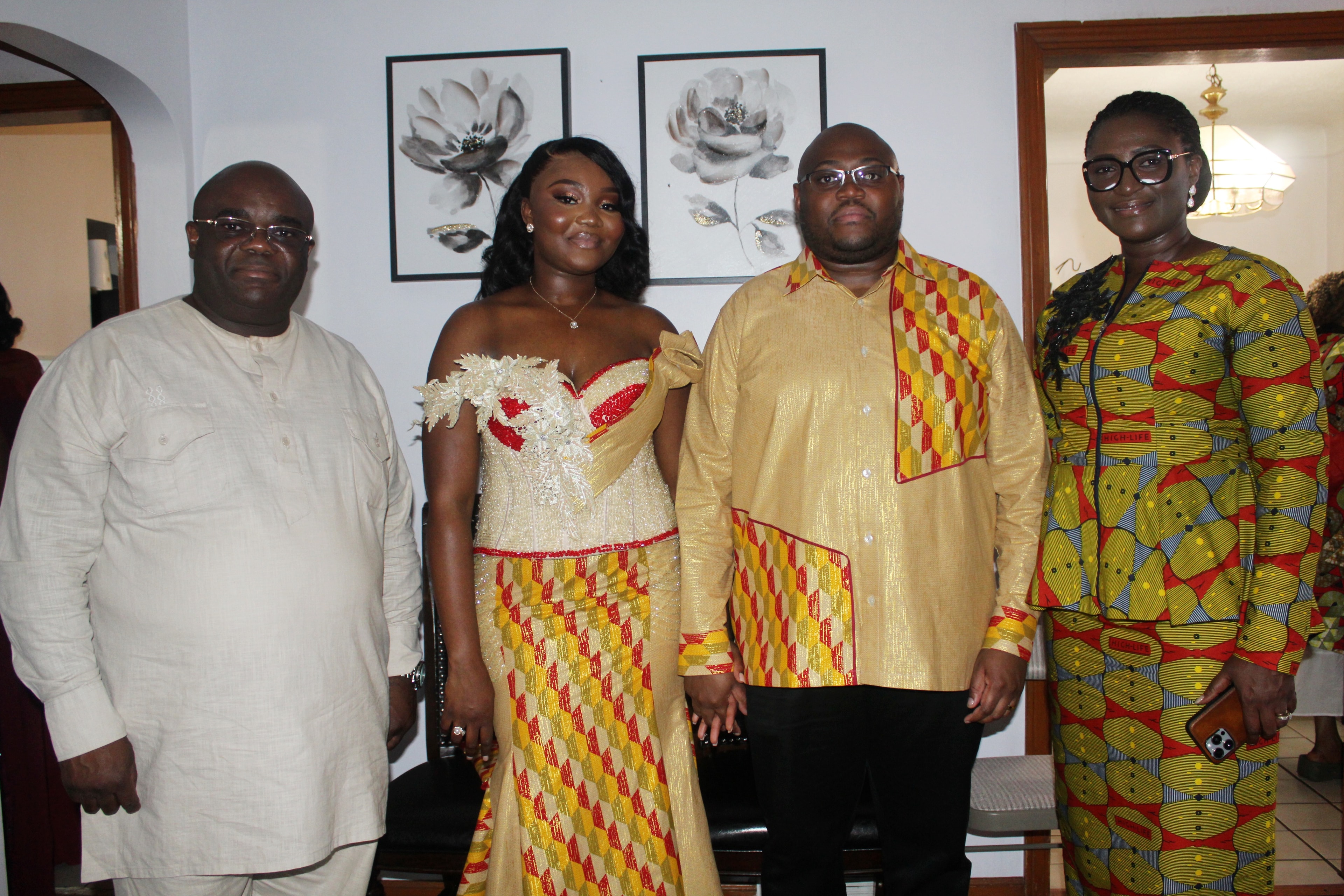 Jean-Philippe and Ketsia Matondo with family in traditional kente attire